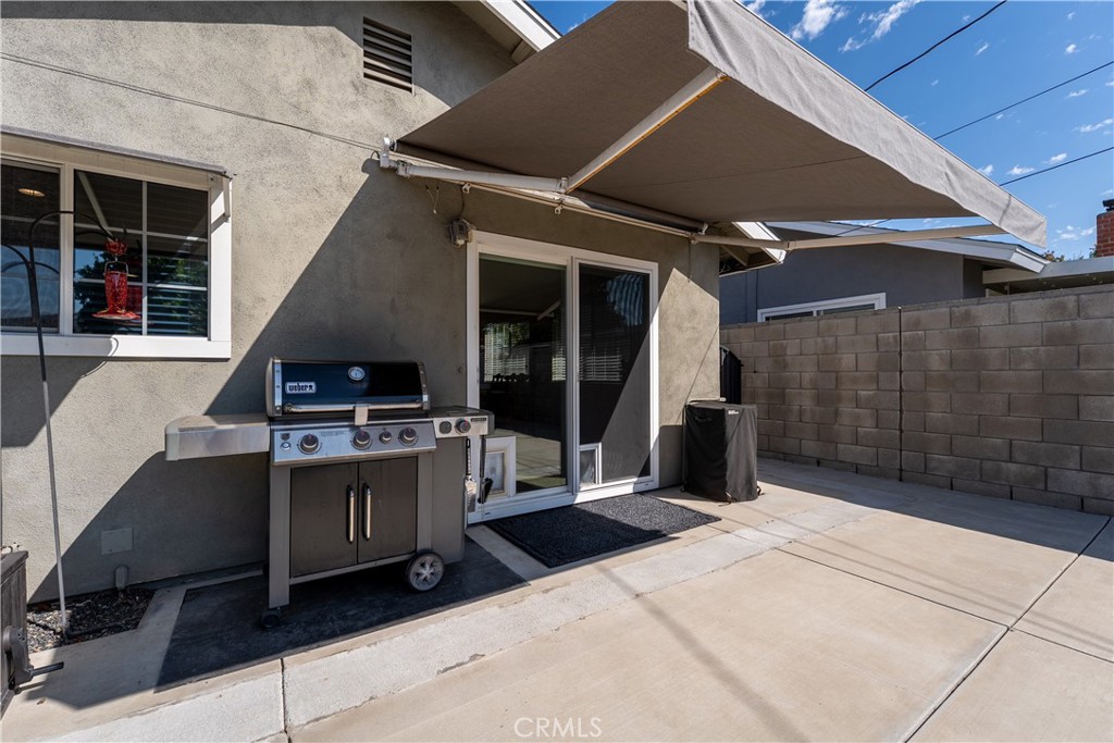 Sliding room door off of kitchen dining area out to backyard towards the Spa. - 390 N Milford Road, Orange CA 92867 - photo 59