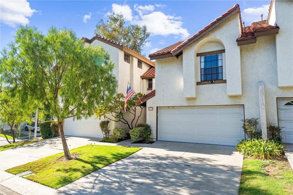 Attached two car garage with full sized driveway. - 4609 E Via La Paloma 2, Orange CA 92869 - photo 1