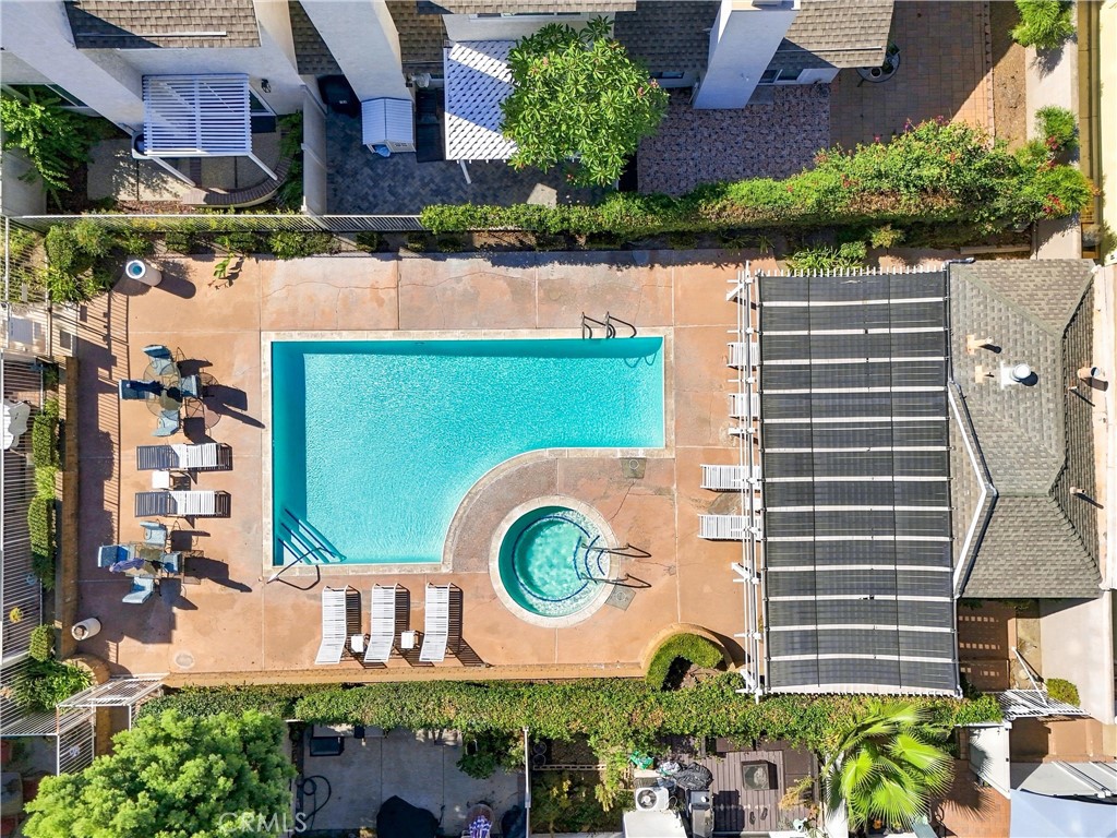 Residents of Countryside enjoy access to a community pool and spa, along with beautifully maintained common areas. - 5049 E Almond Avenue 4, Orange CA 92869 - photo 44