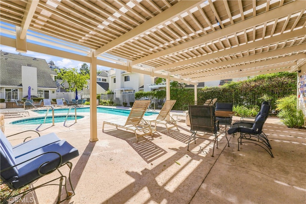 Residents of Countryside enjoy access to a community pool and spa, along with beautifully maintained common areas. - 5049 E Almond Avenue 4, Orange CA 92869 - photo 45