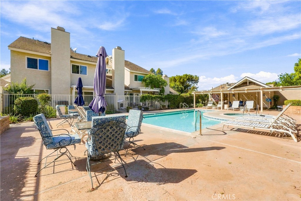 Residents of Countryside enjoy access to a community pool and spa, along with beautifully maintained common areas. - 5049 E Almond Avenue 4, Orange CA 92869 - photo 46