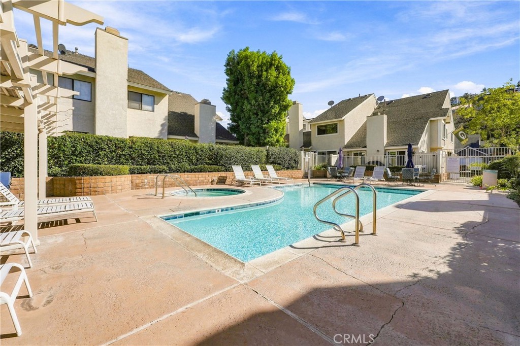 Residents of Countryside enjoy access to a community pool and spa, along with beautifully maintained common areas. - 5049 E Almond Avenue 4, Orange CA 92869 - photo 47