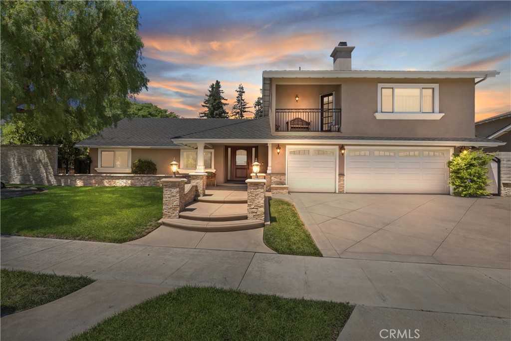 Front View Enhanced with photo-cell controlled lighting. - 5215 E Playano Avenue, Orange CA 92867 - photo 1