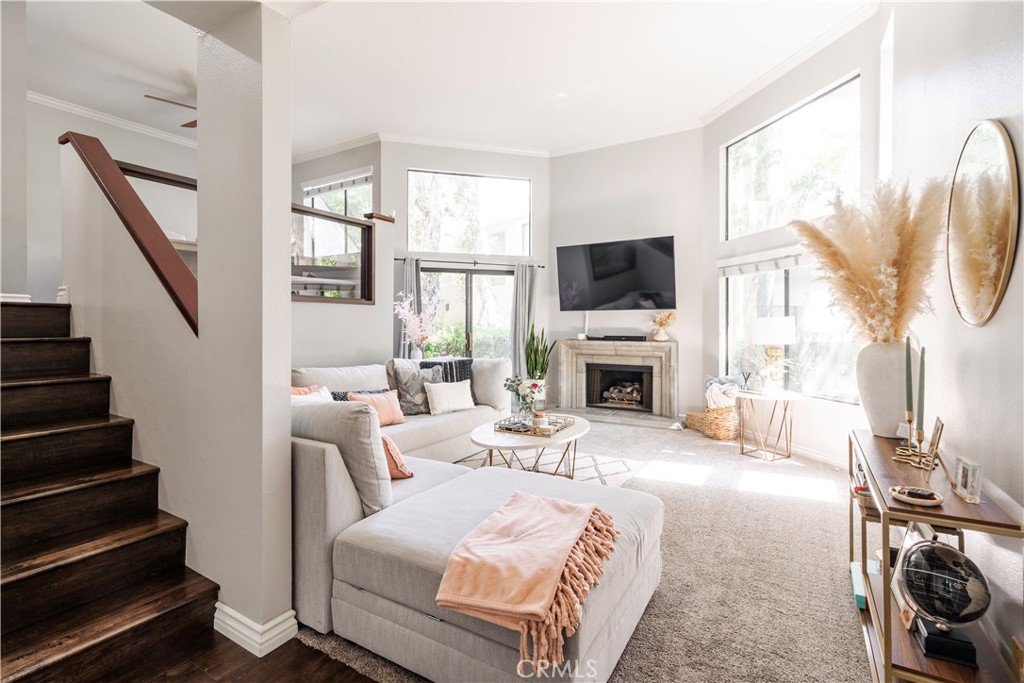 Open bright living room with tall ceilings and windows - 5715 E Stillwater, Orange CA 92869 - photo 1