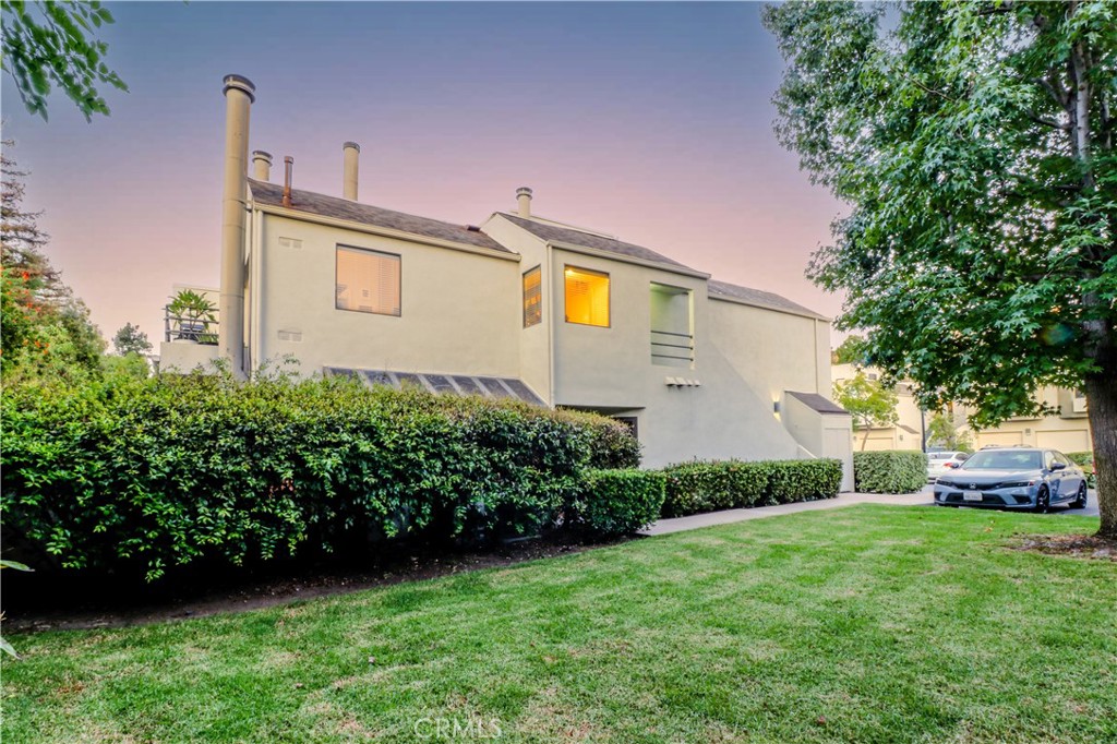 Side with Entrance - 5744 E Creekside 21, Orange CA 92869 - photo 2