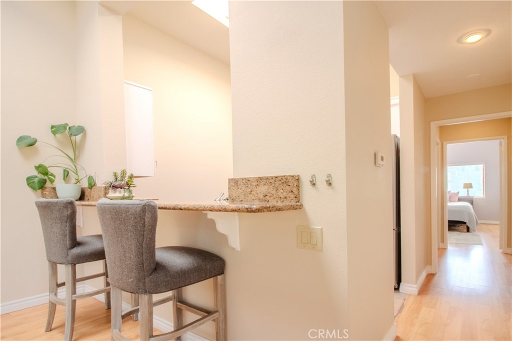 Kitchen with Bar Top and Seating - 5744 E Creekside 21, Orange CA 92869 - photo 20