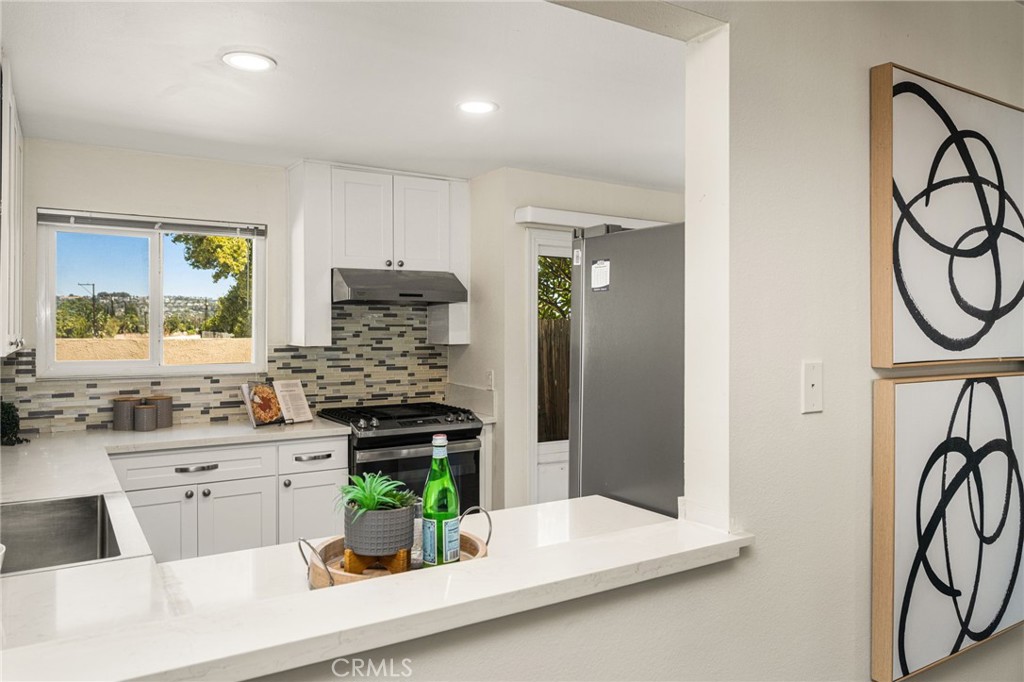 Kitchen pass-through to dining area - 621 W Fletcher 24, Orange CA 92865 - photo 15