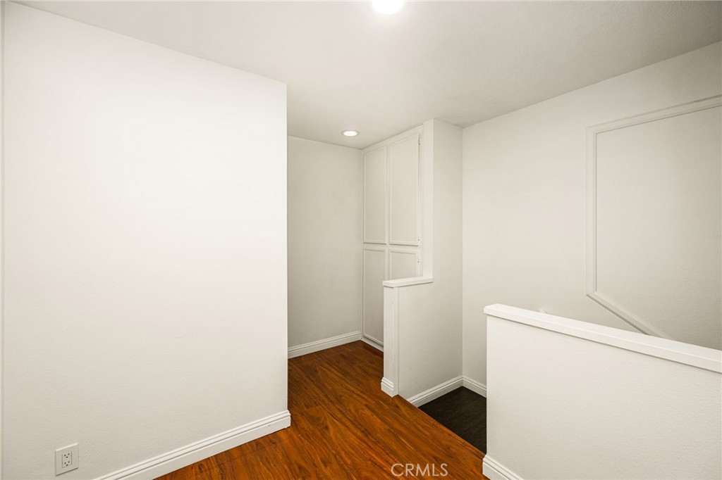 Upstairs hallway with storage - 621 W Fletcher 24, Orange CA 92865 - photo 38