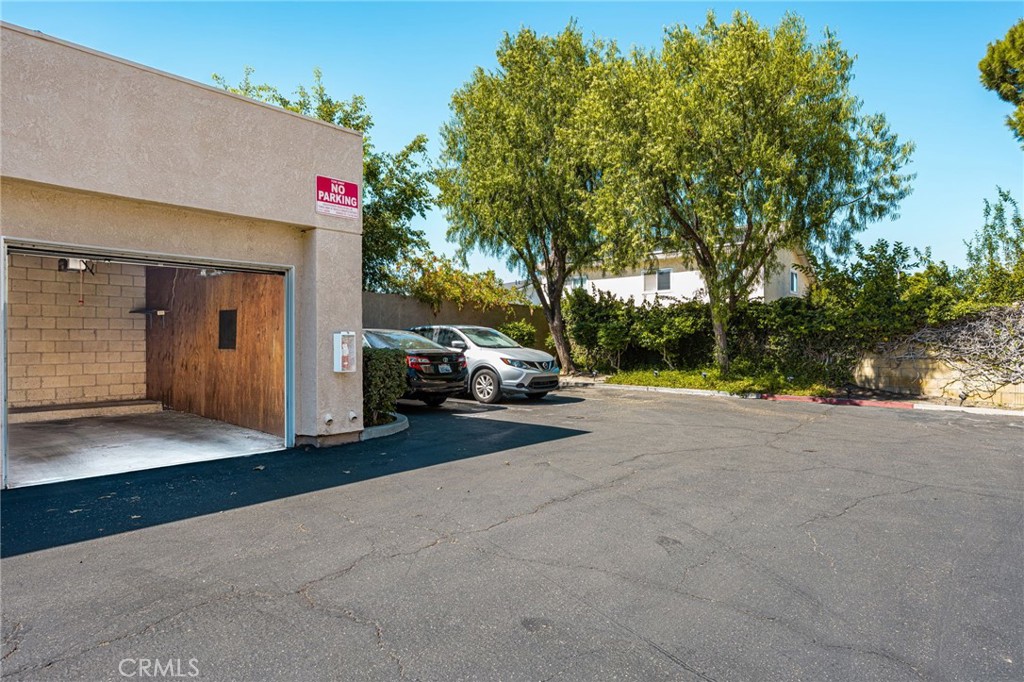 Garage and driveway - 621 W Fletcher 24, Orange CA 92865 - photo 47