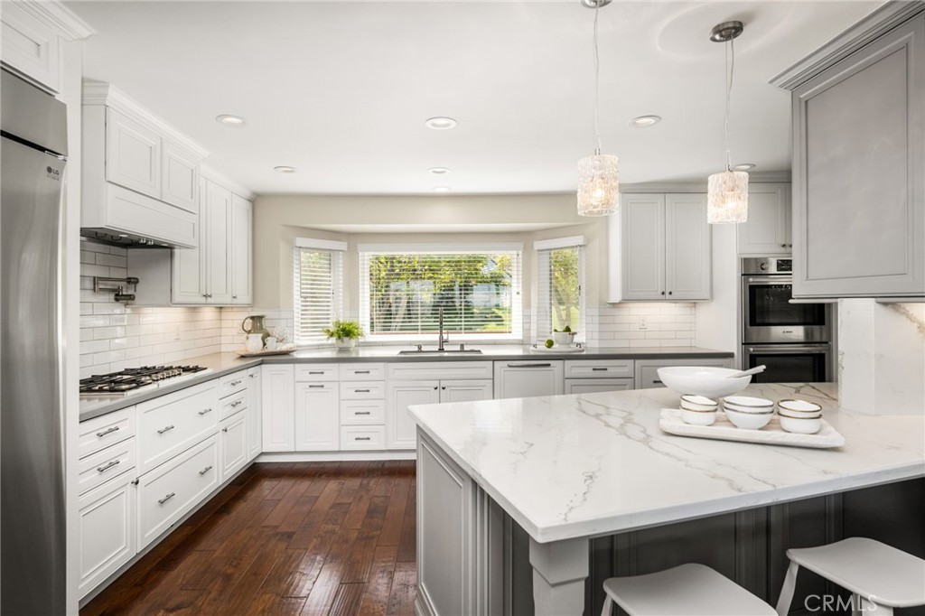 Yes please, a chef's kitchen, pot filler over stove and pull out step under stove to help reach higher cabinets - 6703 E La Cumbre, Orange CA 92869 - photo 21