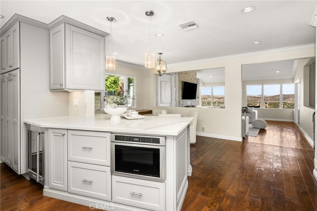 under counter slide out microwave, wine fridge - 6703 E La Cumbre, Orange CA 92869 - photo 25
