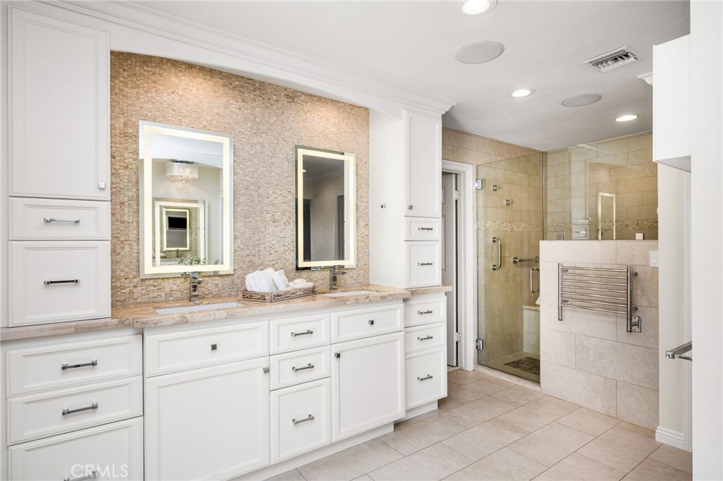 Primary bath with walk in shower and heated towel bar - 6703 E La Cumbre, Orange CA 92869 - photo 48