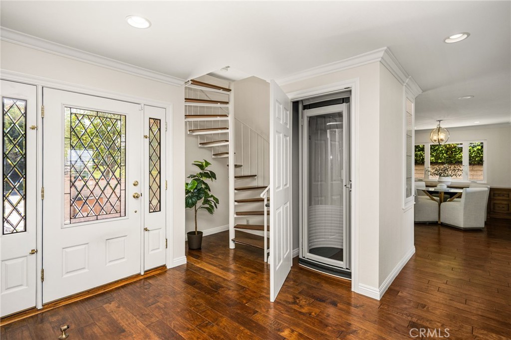 See the glass door? That's an elevator to the upstairs room - 6703 E La Cumbre, Orange CA 92869 - photo 55