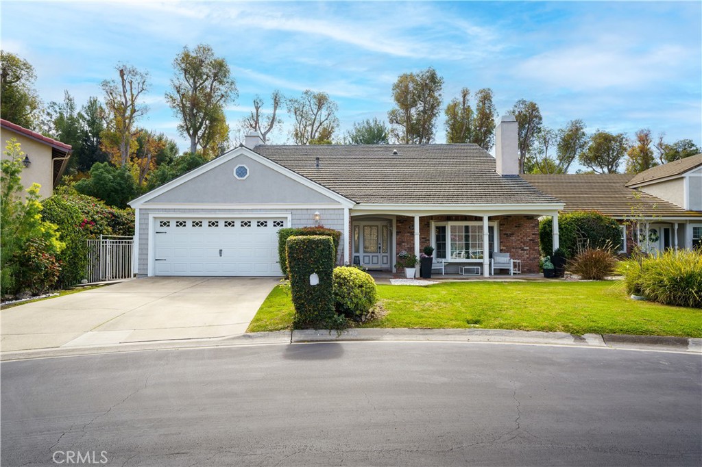Nestled on a quiet cul-de-sac in the exclusive Pheasant Run community, this beautifully maintained home welcomes you wit - 7318 E Cambria, Orange CA 92869 - photo 1