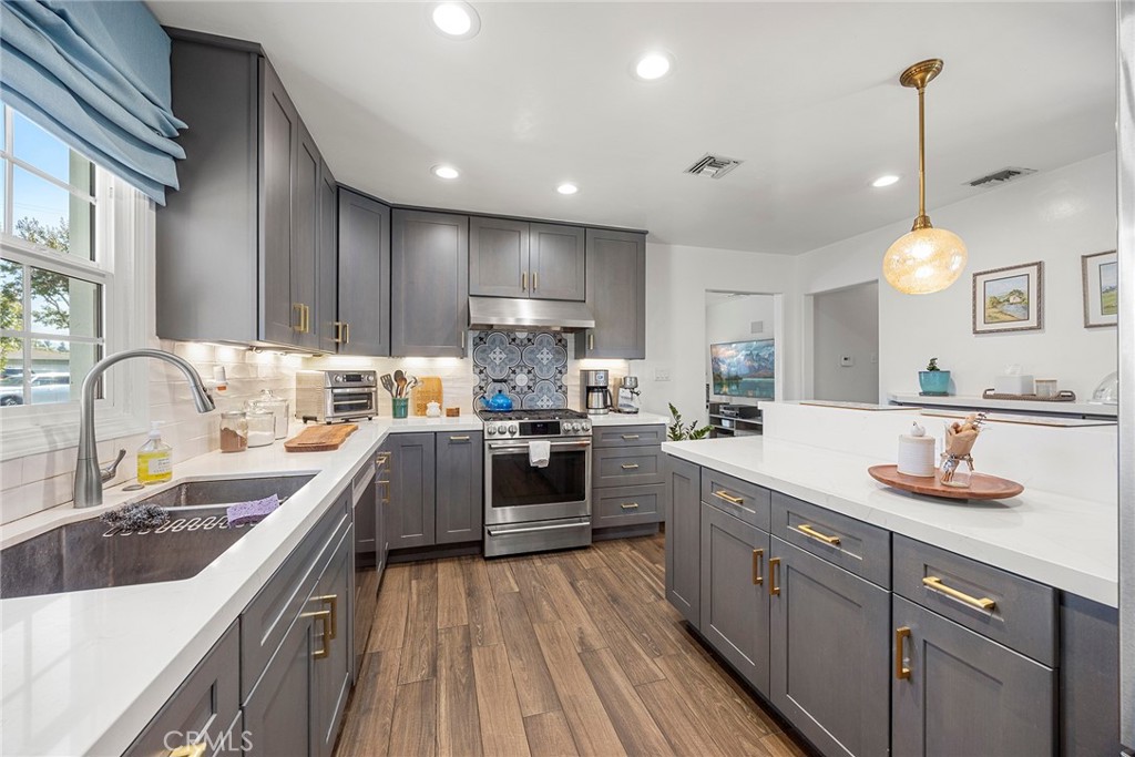 Welcome to Victoria street! Updated Kitchen with stainless steel appliances, Quartz countertops and ample cabinetry. - 774 N Victoria Drive, Orange CA 92867 - photo 1