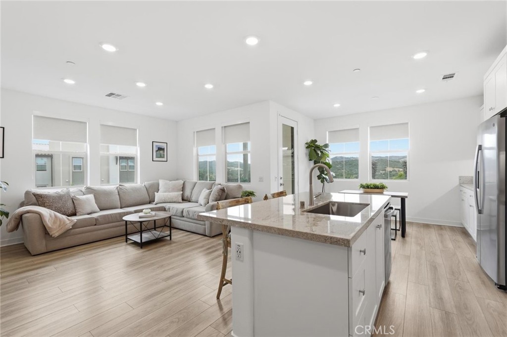Living Room and Kitchen Island - 1000 Lasso Way 301, Rancho Mission Viejo CA 92694 - photo 1