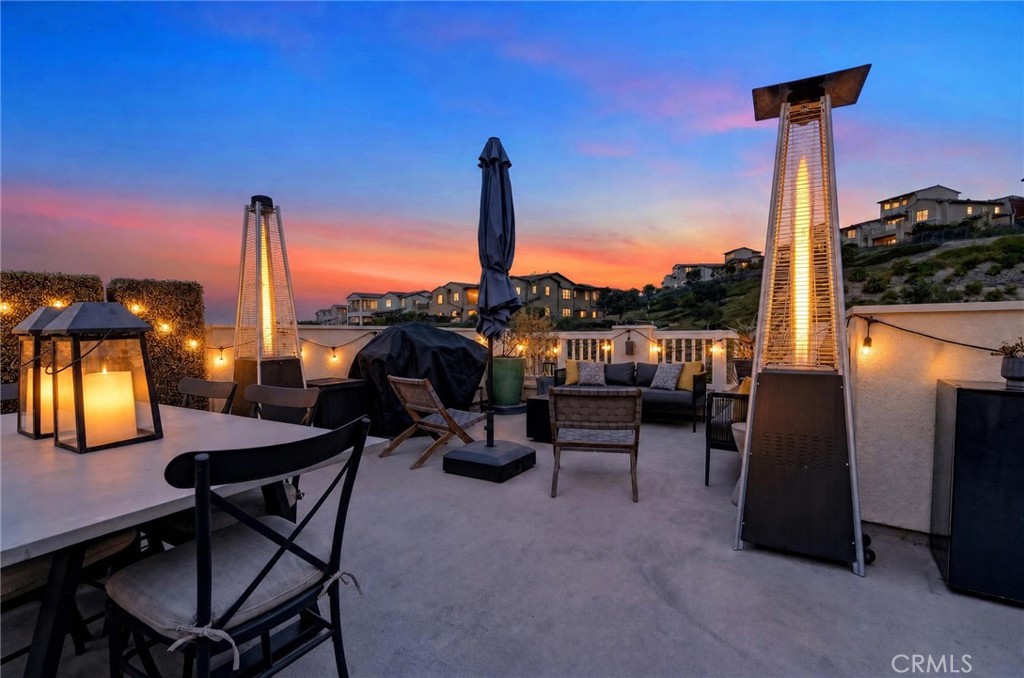 Digitally enhanced twilight photo of the rooftop deck. - 14 Marisol, Rancho Mission Viejo CA 92694 - photo 2