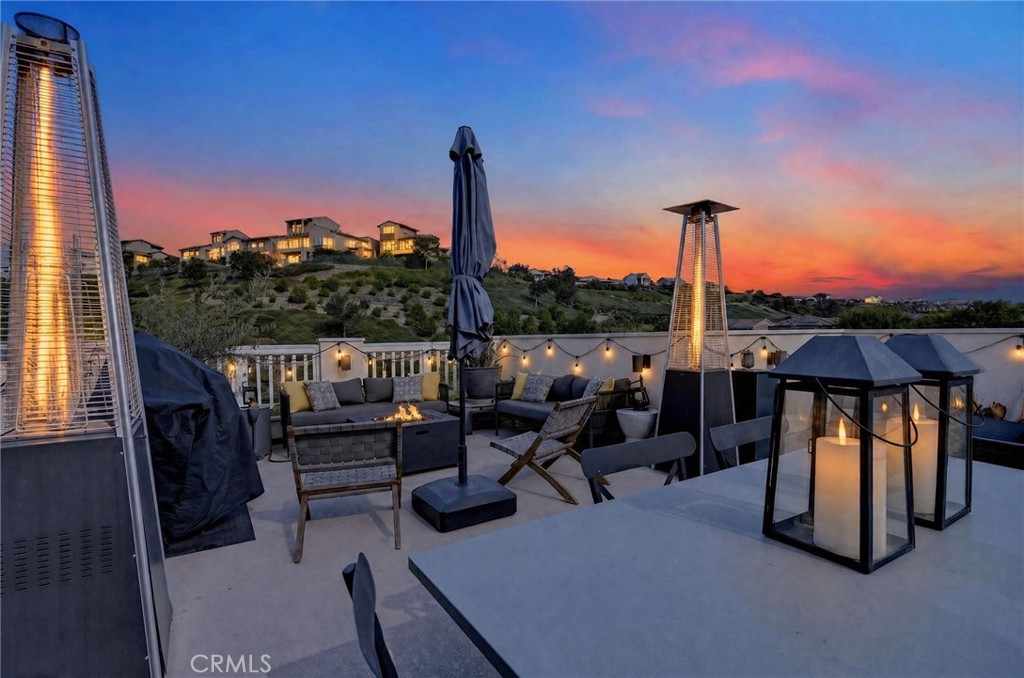 Digitally enhanced twilight photo of the rooftop deck. - 14 Marisol, Rancho Mission Viejo CA 92694 - photo 3