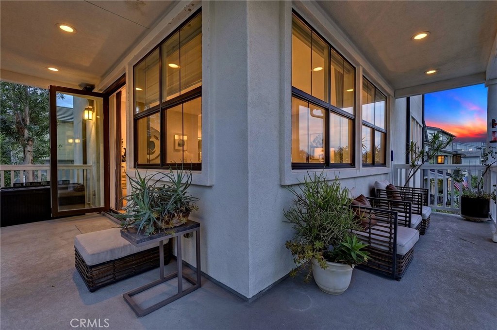 Digitally enhanced photo of the wrap around porch looking into the family room and kitchen. - 14 Marisol, Rancho Mission Viejo CA 92694 - photo 5