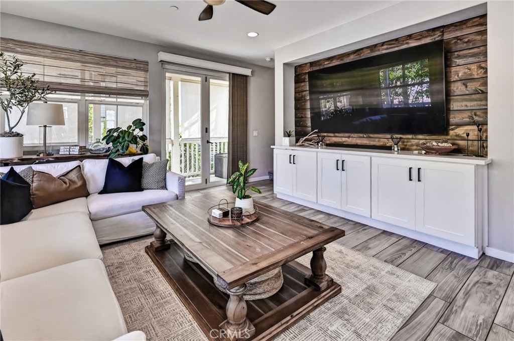Family Room has upgraded built in cabinets and rustic wood accents behind the TV area. - 14 Marisol, Rancho Mission Viejo CA 92694 - photo 16