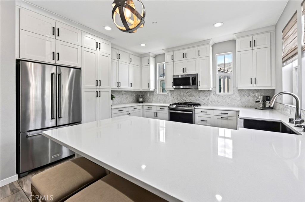 Lots of counter and cabinet space can be found in this upgraded kitchen. - 14 Marisol, Rancho Mission Viejo CA 92694 - photo 28
