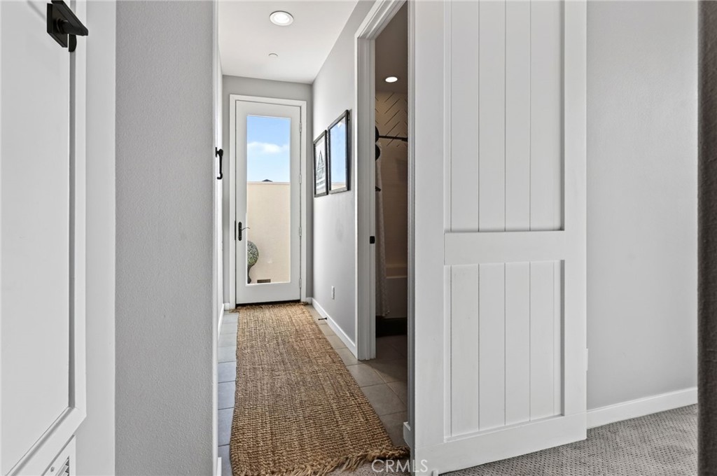 An upgraded Barn Door separates the area to the fourth bedroom and the entrance to the Rooftop Deck. - 14 Marisol, Rancho Mission Viejo CA 92694 - photo 40