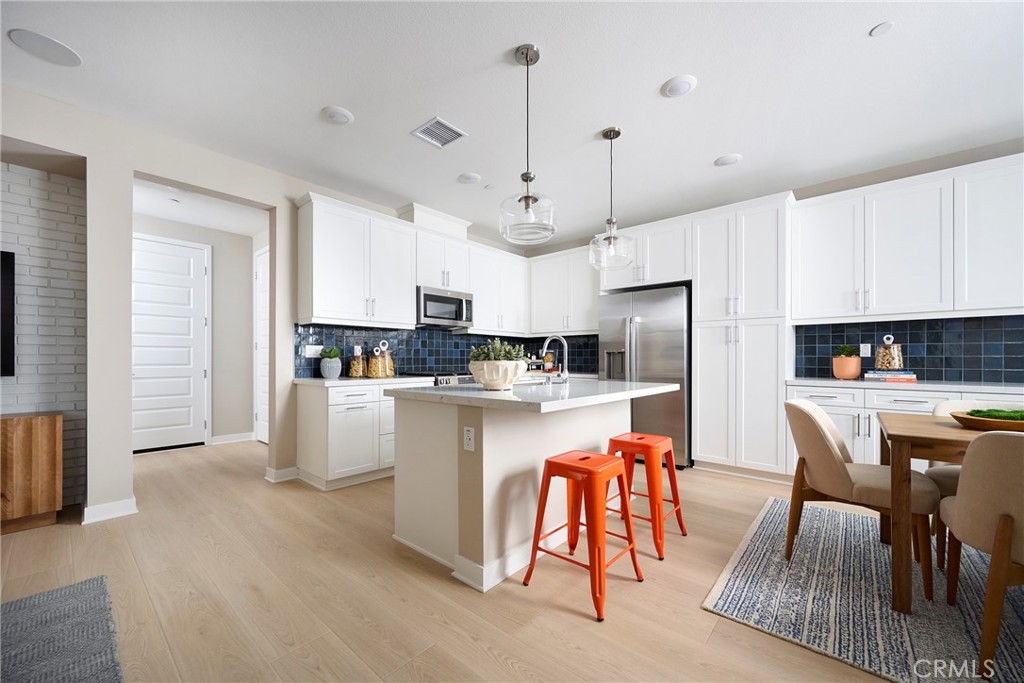 Model Photos: Photos shown are of the model home for this floor plan. Actual finishes, features, and landscaping may var - 1727 Scarlett Road, Rancho Mission Viejo CA 92694 - photo 5