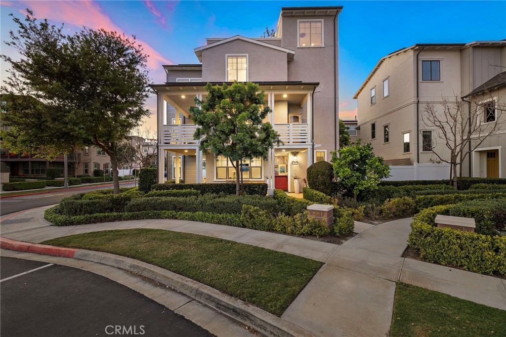 Evening exterior illuminated by warm lighting and an inviting front elevation. - 26 Yerra, Rancho Mission Viejo CA 92694 - photo 1