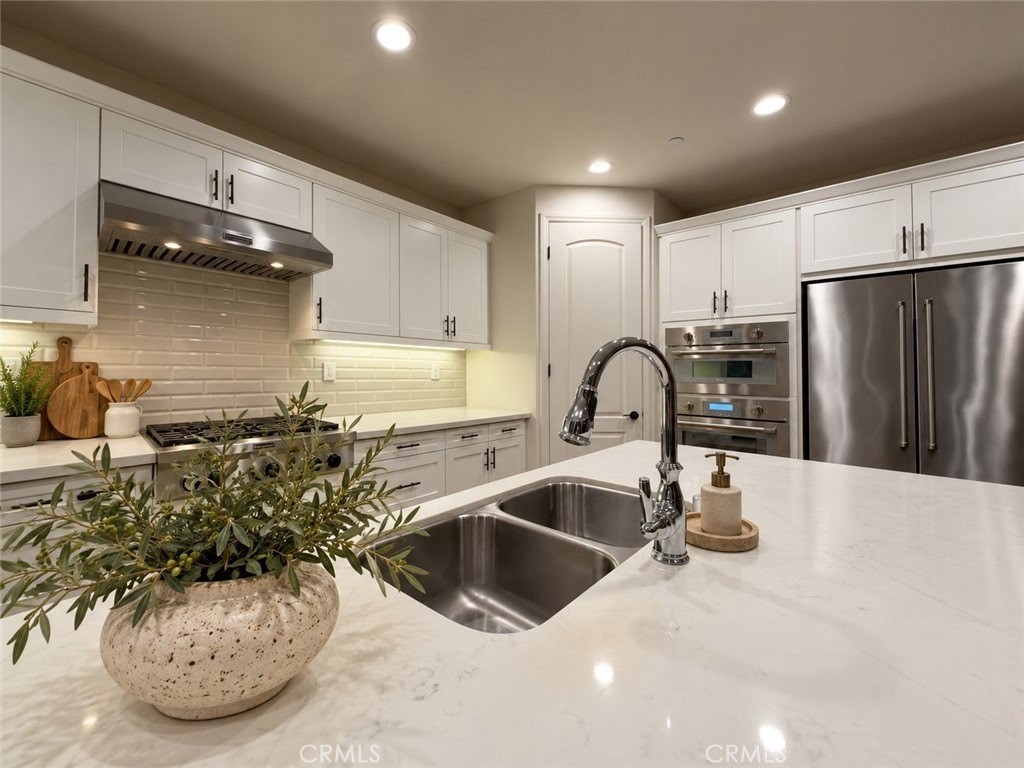 Kitchen sink and appliances. Virtually - 31 Garcilla Drive, Rancho Mission Viejo CA 92694 - photo 12