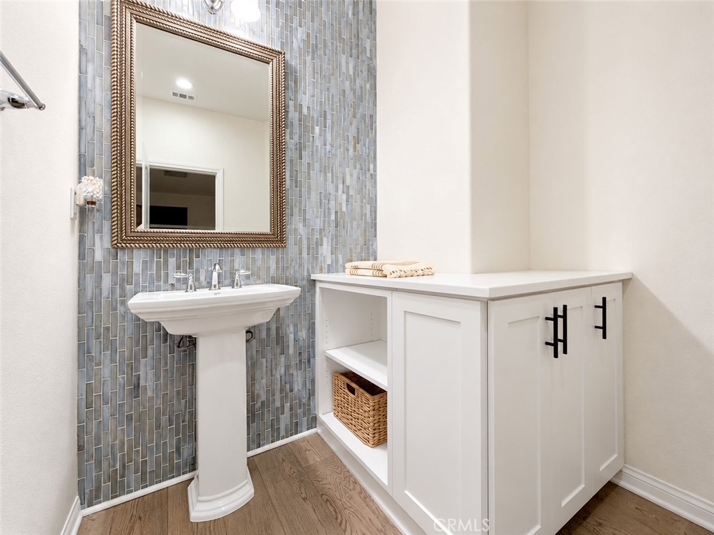 Powder bathroom, reverse. Virtually staged with furniture and decorative accessories digitally added. Enhanced unfurnish - 31 Garcilla Drive, Rancho Mission Viejo CA 92694 - photo 31