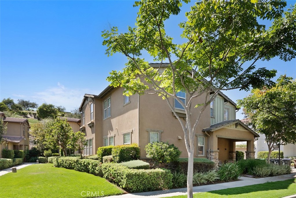 (Unaltered photo of exterior of home) Modern Craftsman architecture complemented by professionally landscaped grounds, a - 33 Lomada Street, Rancho Mission Viejo CA 92694 - photo 2