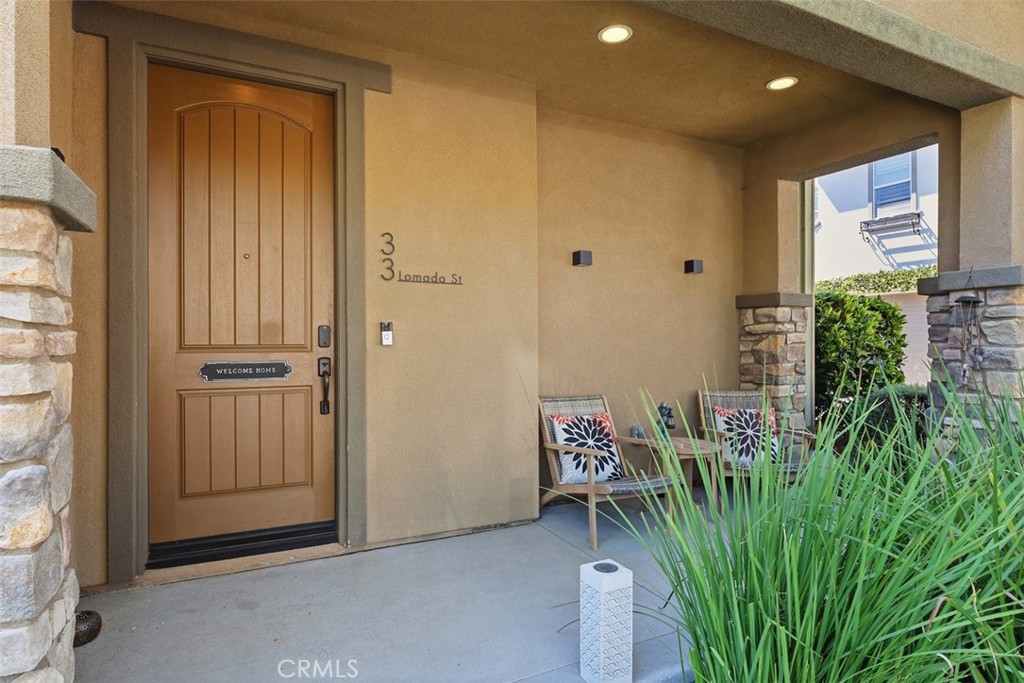 Relax on the inviting covered front porch. An ideal place to enjoy your morning coffee while overlooking the beautifully - 33 Lomada Street, Rancho Mission Viejo CA 92694 - photo 4