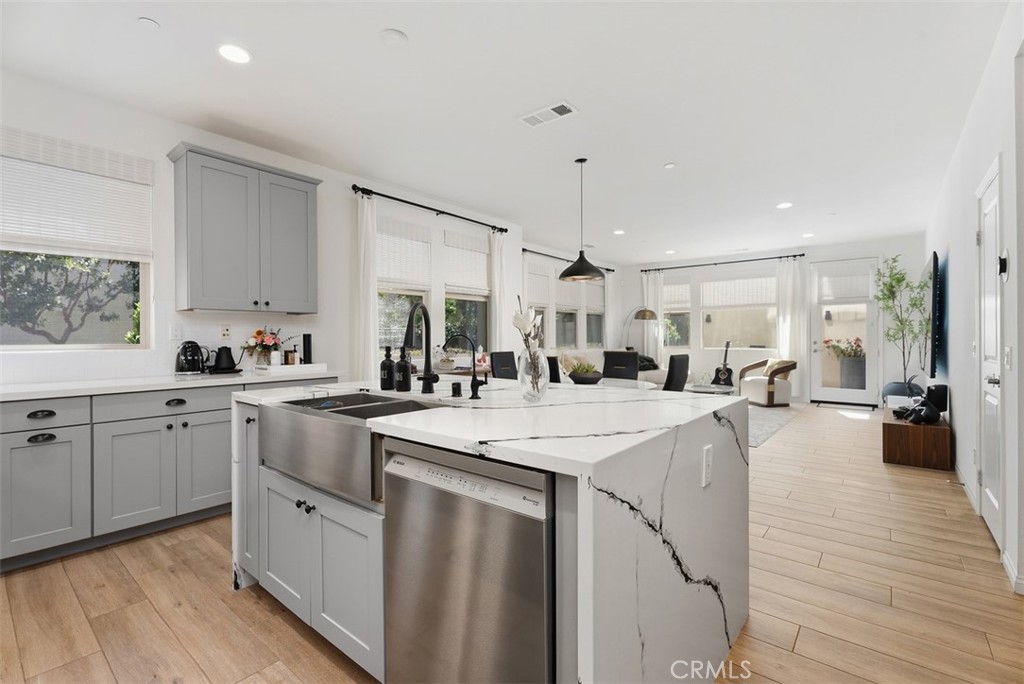 A thoughtful redesign transformed the original coat closet into a spacious pantry, providing exceptional storage and org - 33 Lomada Street, Rancho Mission Viejo CA 92694 - photo 10