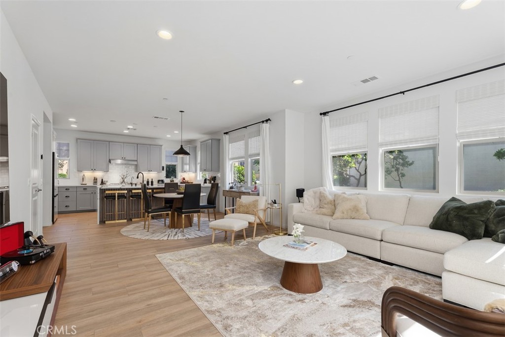 Designed for modern living, the expansive great room showcases newly installed luxury vinyl plank flooring and thoughtfu - 33 Lomada Street, Rancho Mission Viejo CA 92694 - photo 14
