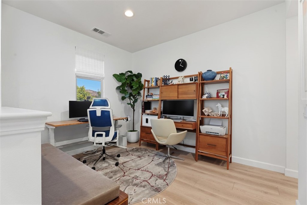 The spacious upstairs loft offers flexible living space ideal for a home office, media room, playroom, fitness area, or - 33 Lomada Street, Rancho Mission Viejo CA 92694 - photo 18