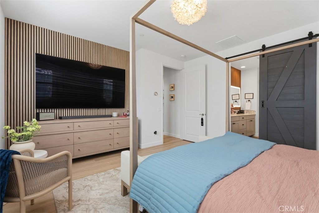Wake up in a spacious primary retreat featuring a custom barn door, thoughtfully designed finishes, and a peaceful atmos - 33 Lomada Street, Rancho Mission Viejo CA 92694 - photo 21
