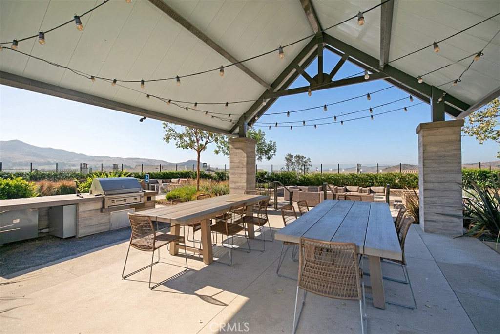 Enjoy resort-style living with covered outdoor dining, built-in BBQs, and gathering spaces designed for effortless enter - 33 Lomada Street, Rancho Mission Viejo CA 92694 - photo 28