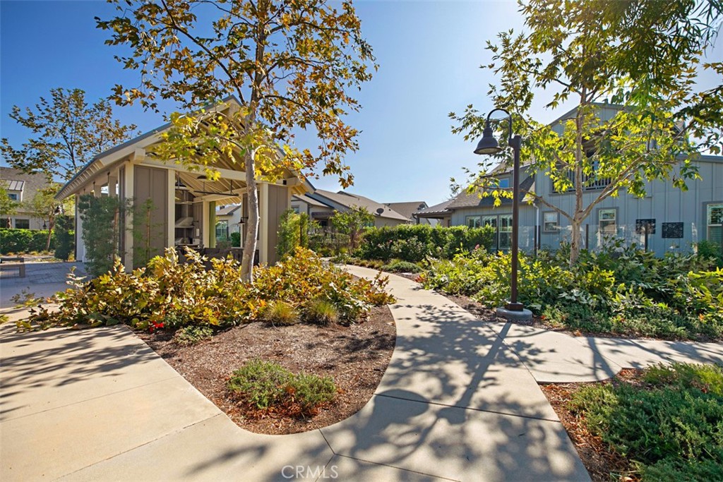 Beautifully landscaped pathways connect residents to parks, pools, fitness amenities, playgrounds, and the exceptional l - 33 Lomada Street, Rancho Mission Viejo CA 92694 - photo 37
