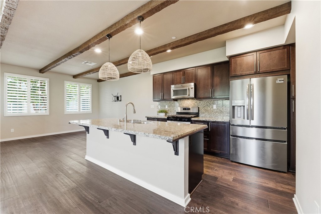Beautiful open kitchen with granite,New refrigerator, new oven/range and shutters! - 77 Adelfa Street, Rancho Mission Viejo CA 92694 - photo 11