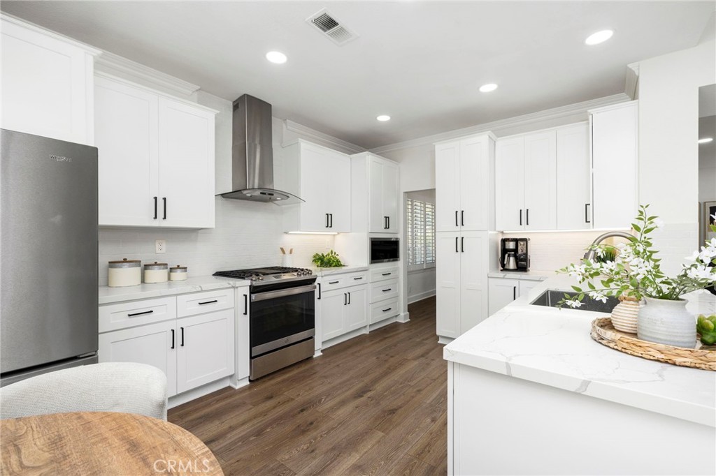 Stainless appliances, new cabinetry, quartz countertops, LED lighting - 1 Villamoura, Rancho Santa Margarita CA 92679 - photo 10