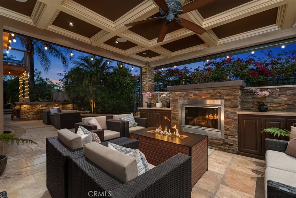 Covered Patio/California Great Room with Fireplace, Coffered Ceilings, and Mini Fridge - 10 Thorn Oak, Rancho Santa Margarita CA 92679 - photo 5