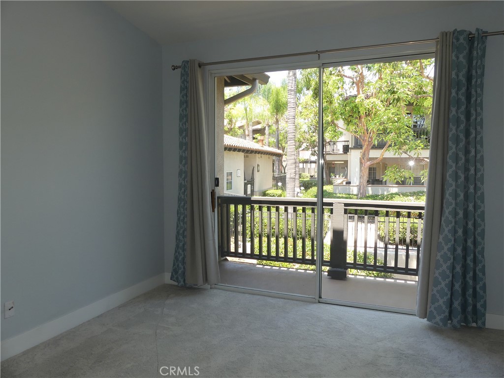 Second bedroom with private balcony - 11 Via Pausa, Rancho Santa Margarita CA 92688 - photo 25