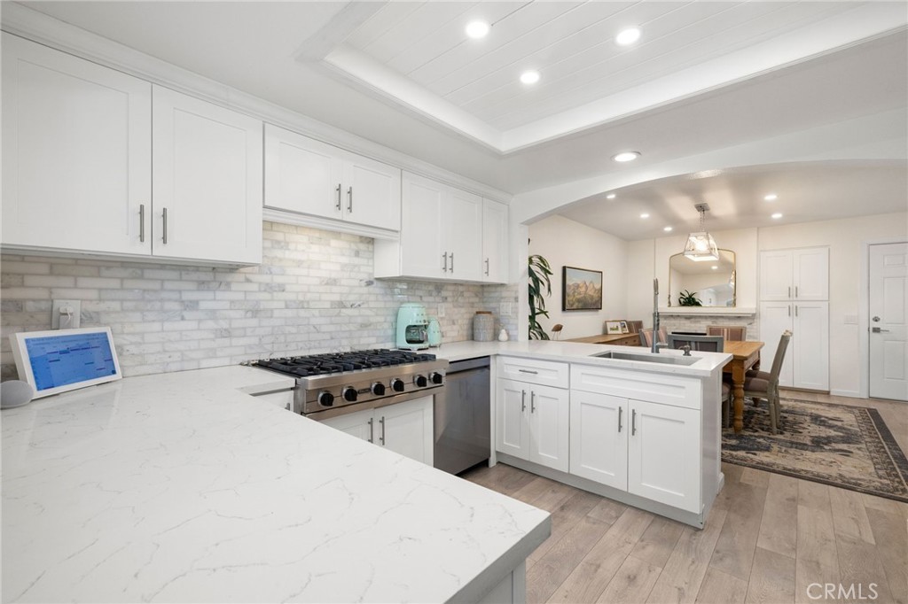 Kitchen with breakfast bar is open to the family room - 14 Vista Lago, Rancho Santa Margarita CA 92688 - photo 10