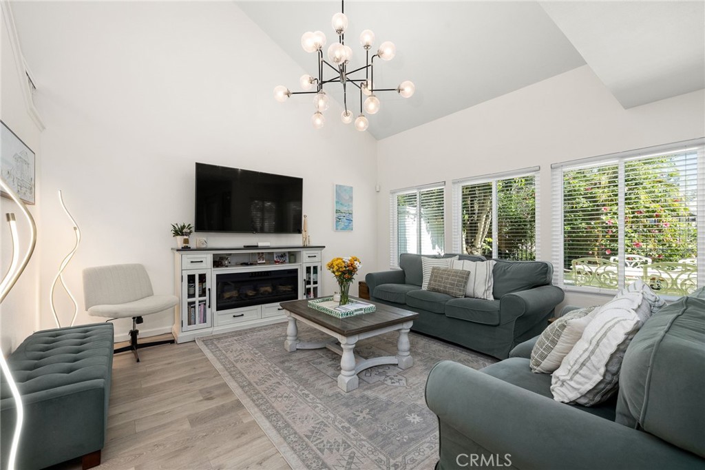 Spacious living room with high ceilings and lake views - 14 Vista Lago, Rancho Santa Margarita CA 92688 - photo 12