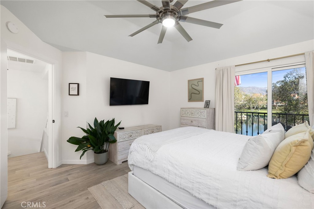 Primary suite opens to balcony overlooking the lake - 14 Vista Lago, Rancho Santa Margarita CA 92688 - photo 17