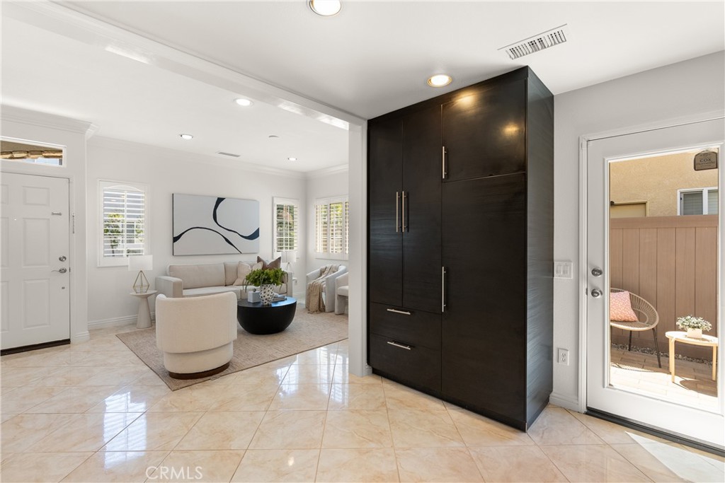 Floor-to-ceiling custom built-in cabinetry offers exceptional storage while creating a seamless transition between the l - 15 Poppyfield, Rancho Santa Margarita CA 92688 - photo 4