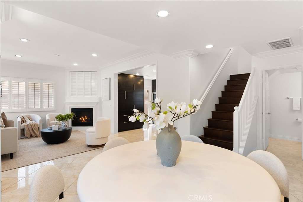 Spacious main level showcasing the effortless transition between the dining area, living room, and staircase, designed f - 15 Poppyfield, Rancho Santa Margarita CA 92688 - photo 14