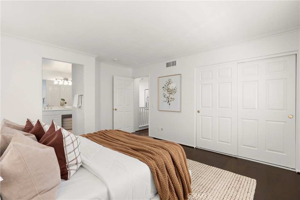 Designed for comfort and functionality, the expansive primary bedroom features generous proportions, dual closets, an en - 15 Poppyfield, Rancho Santa Margarita CA 92688 - photo 18
