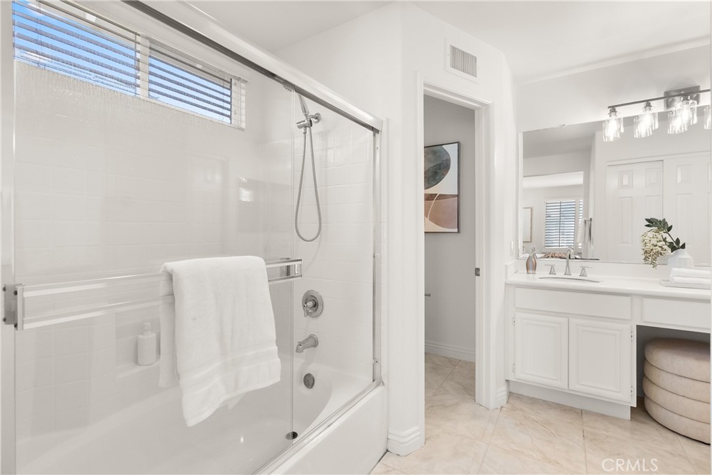 Completing the primary bath is a shower and tub combination, offering the flexibility of a relaxing soak or a quick show - 15 Poppyfield, Rancho Santa Margarita CA 92688 - photo 20