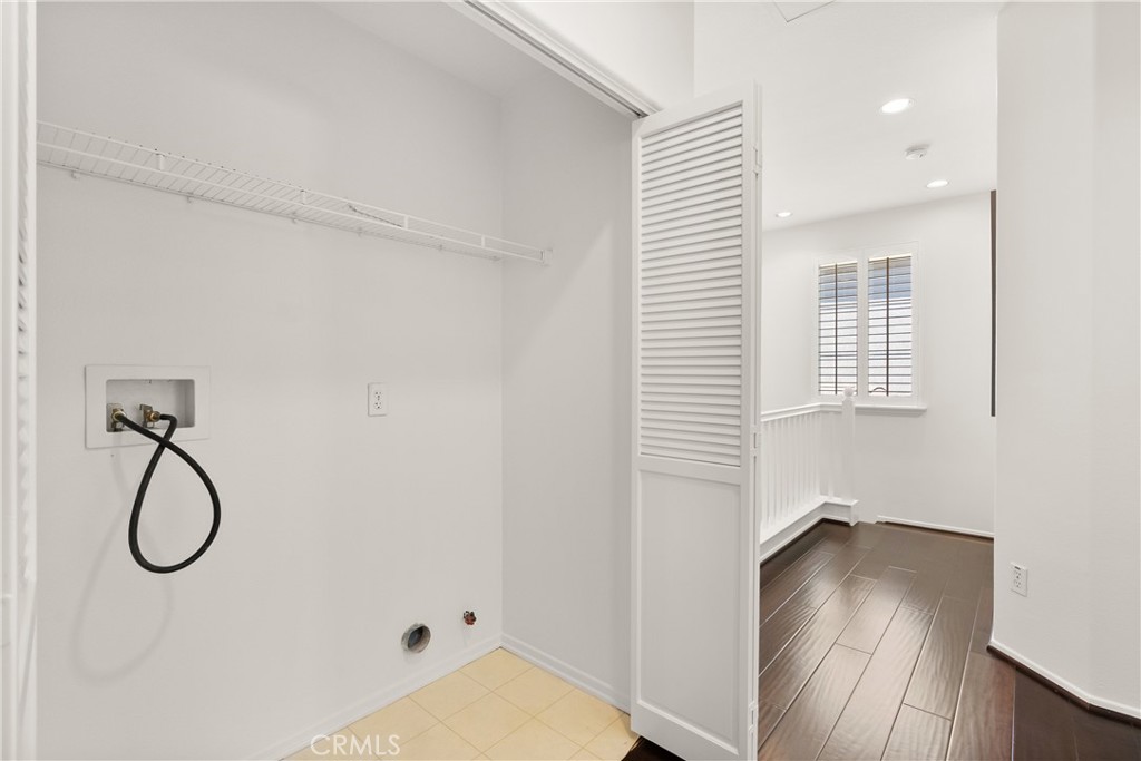 Conveniently located on the second level near all bedrooms, the dedicated laundry room offers built in shelving, washer - 15 Poppyfield, Rancho Santa Margarita CA 92688 - photo 22